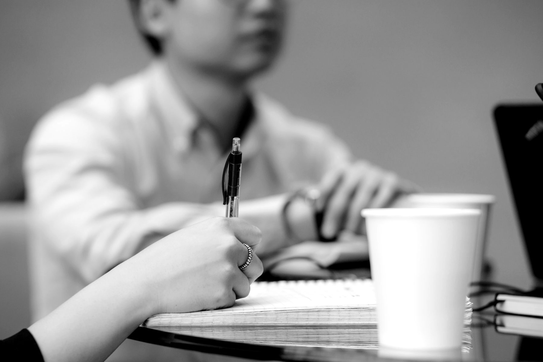 A professional taking notes while learning